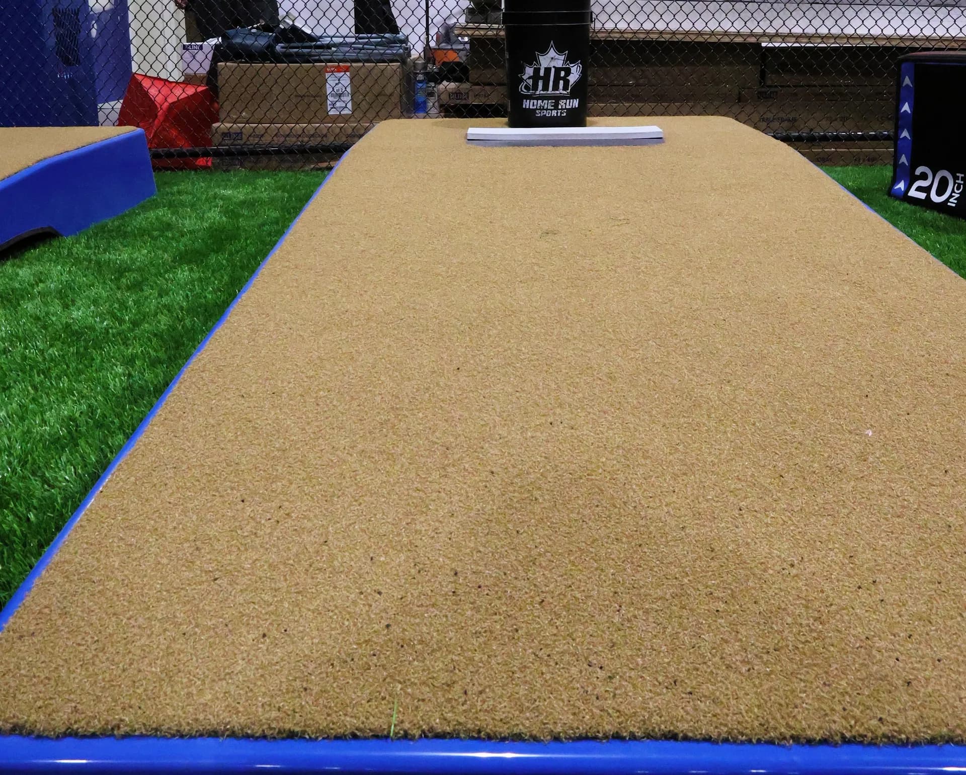 Low view along a pitching mound toward the rubber